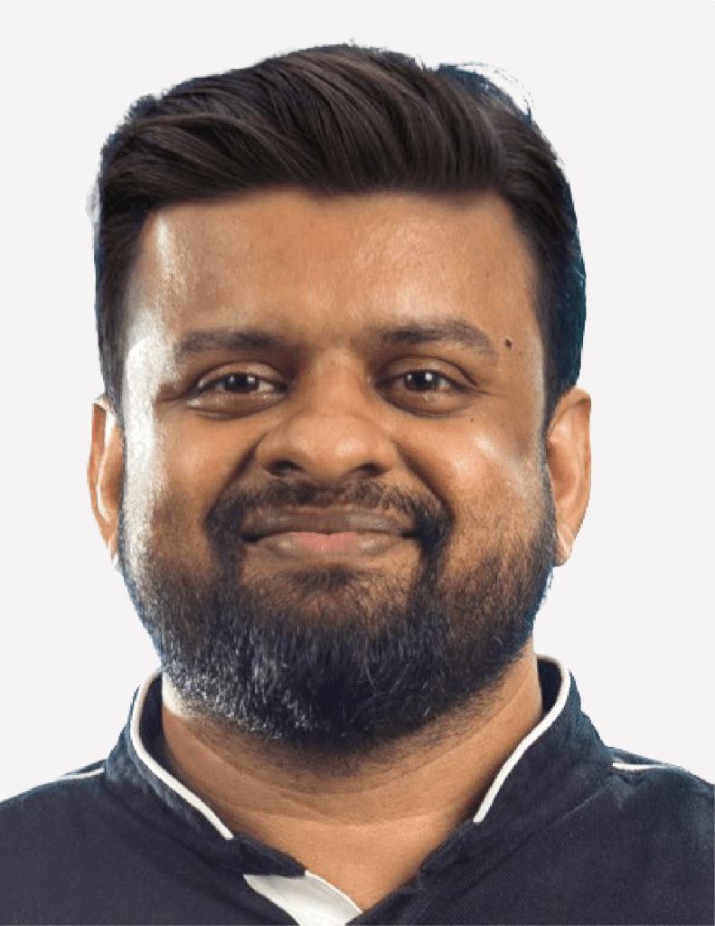 A confident man named Lijo Isac with a neatly groomed beard and a friendly smile.