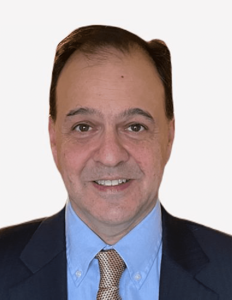 Mark Malaspina, a professional-looking man with a friendly smile, is dressed in a blue suit and light blue shirt, paired with a patterned tie, against a white background.
