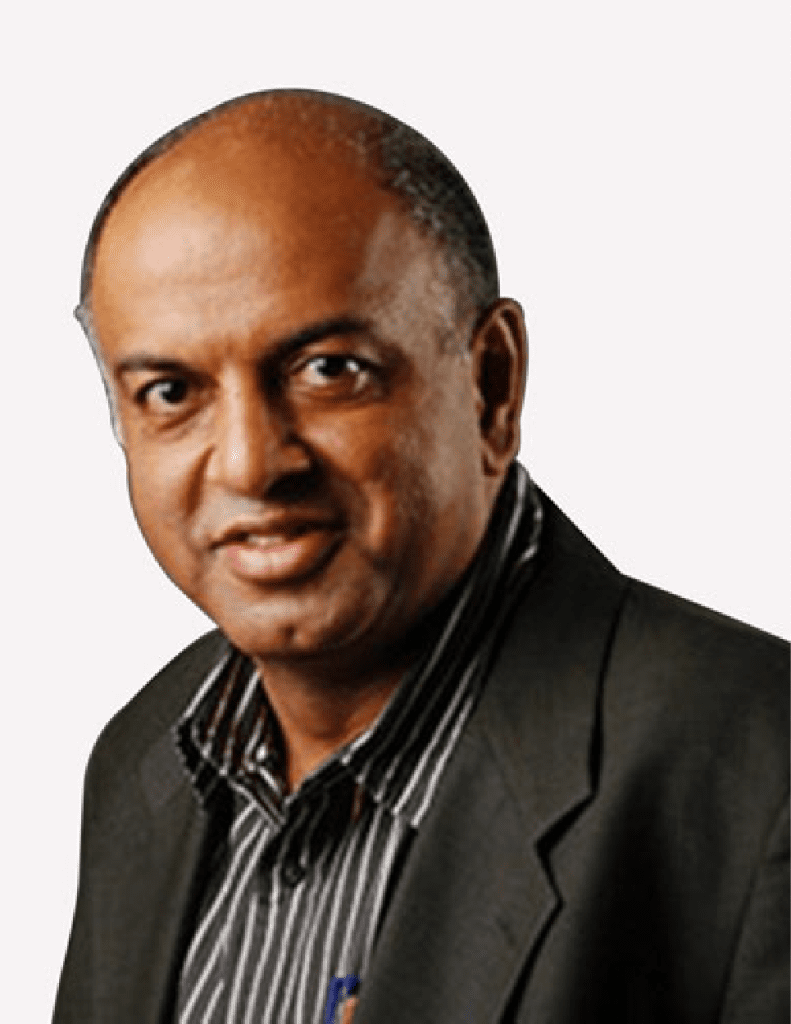A confident man in professional attire with a slight smile, reminiscent of Sanjeev Bhikchandani.