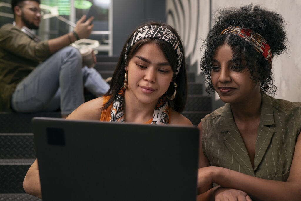 medium-shot-latin-friends-using-technology-hanging-out-scaled