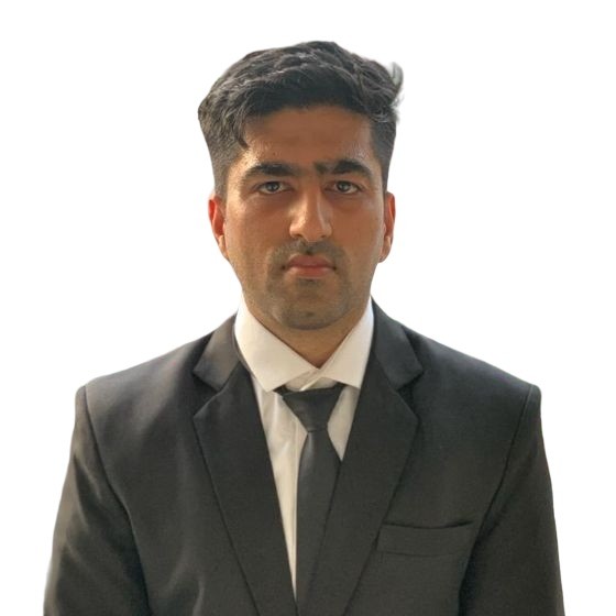 A man wearing a black suit, white dress shirt, and black tie is standing against a plain white background. His dark hair is neatly styled, and he has a serious expression on his face. Meet Amit Singh, an MBA student from IIT Bombay.