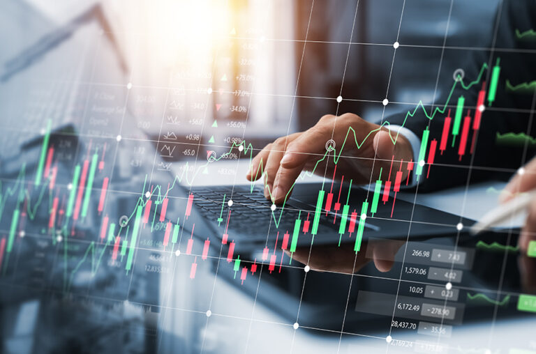 Investors,Use,Laptops,To,Analyze,Stock,Market,,Investment,Strategies