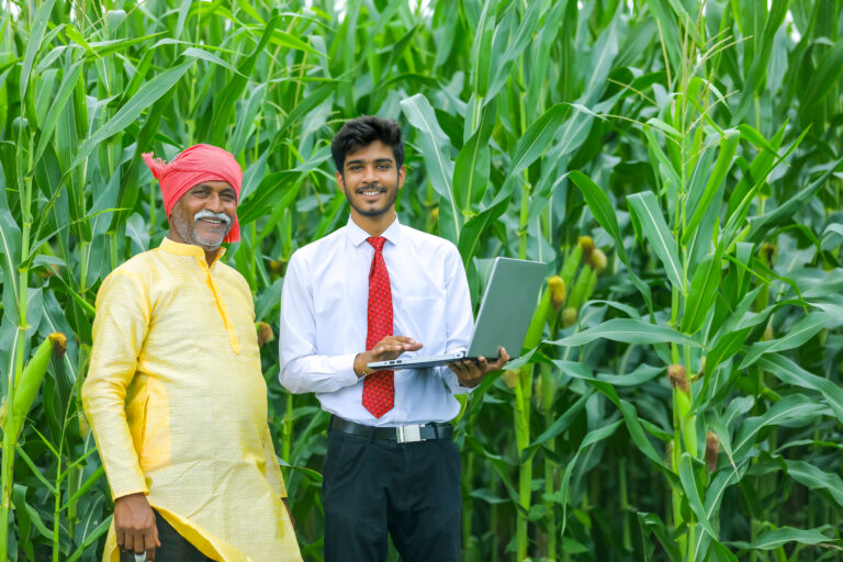 Indian,Farmer,With,Agronomist,At,Corn,Field,And,Showing,Some