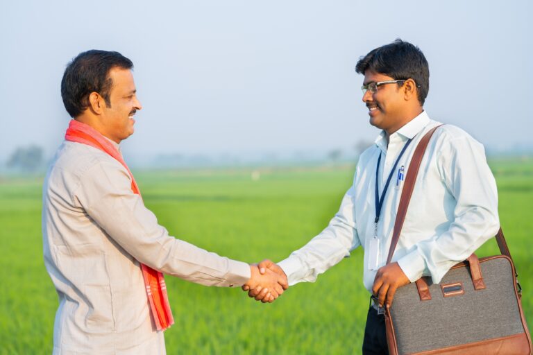 Happy,Village,Farmer,Greeting,Banker,By,Hand,Shake,By,Showing